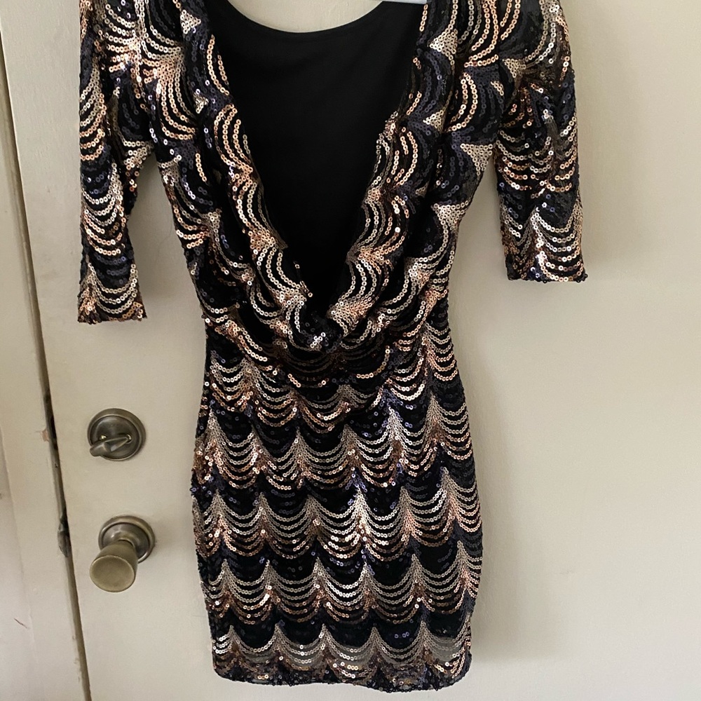 Black and gold sequin dress
